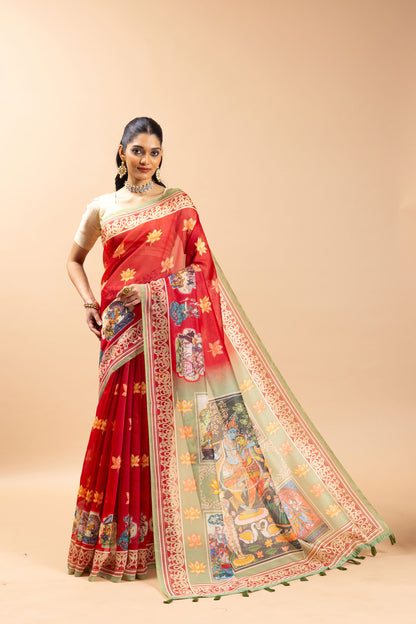 Woman wearing a red saree with intricate patterns on a beige background Radha Ridhaya Chanderi Saree | Yuvani Vesture