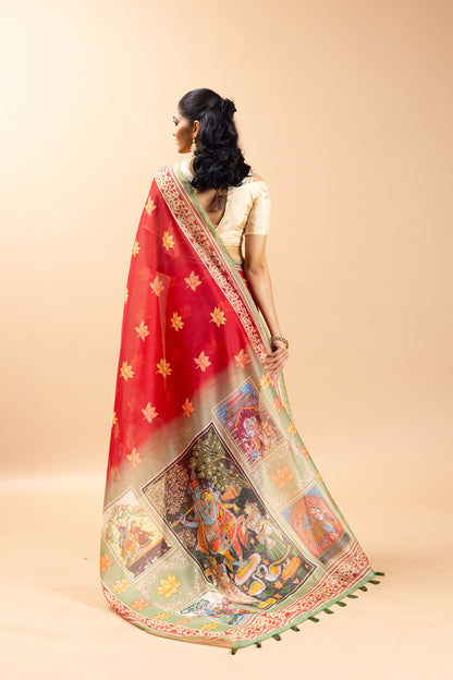 Woman wearing a red saree with a colorful border on a beige background Radha Ridhaya Chanderi Saree | Yuvani Vesture