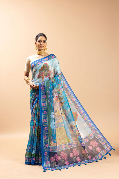Woman wearing a blue and pink saree with a floral design on a beige background Tarangini Chanderi Saree | Yuvani Vesture