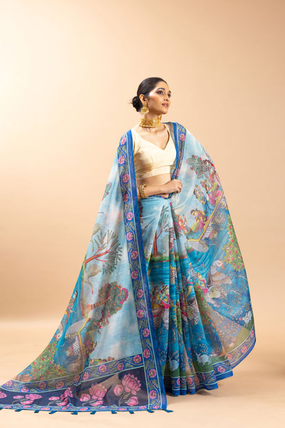 Woman wearing a blue and pink saree with a beige background Tarangini Chanderi Saree | Yuvani Vesture
