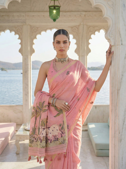 Woman in a pink saree with elephant design standing in a scenic location. Pink Pichwai Jamdani Cotton Saree for women
